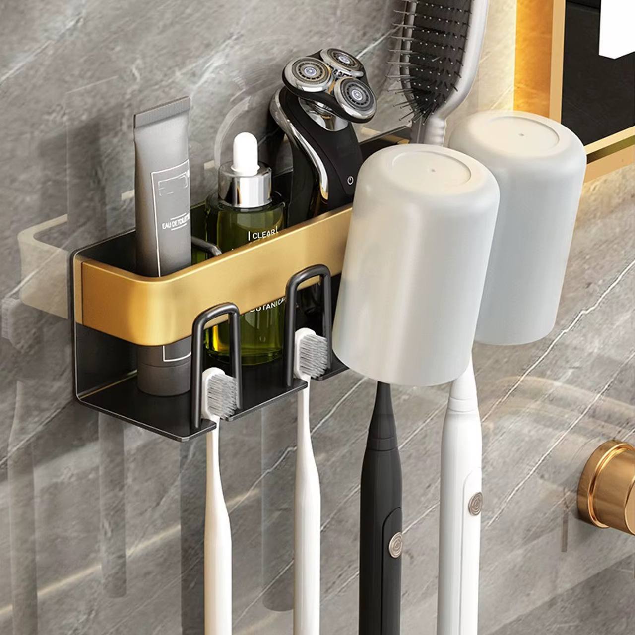 Metallic wall mounted toothbrush/paste holder.