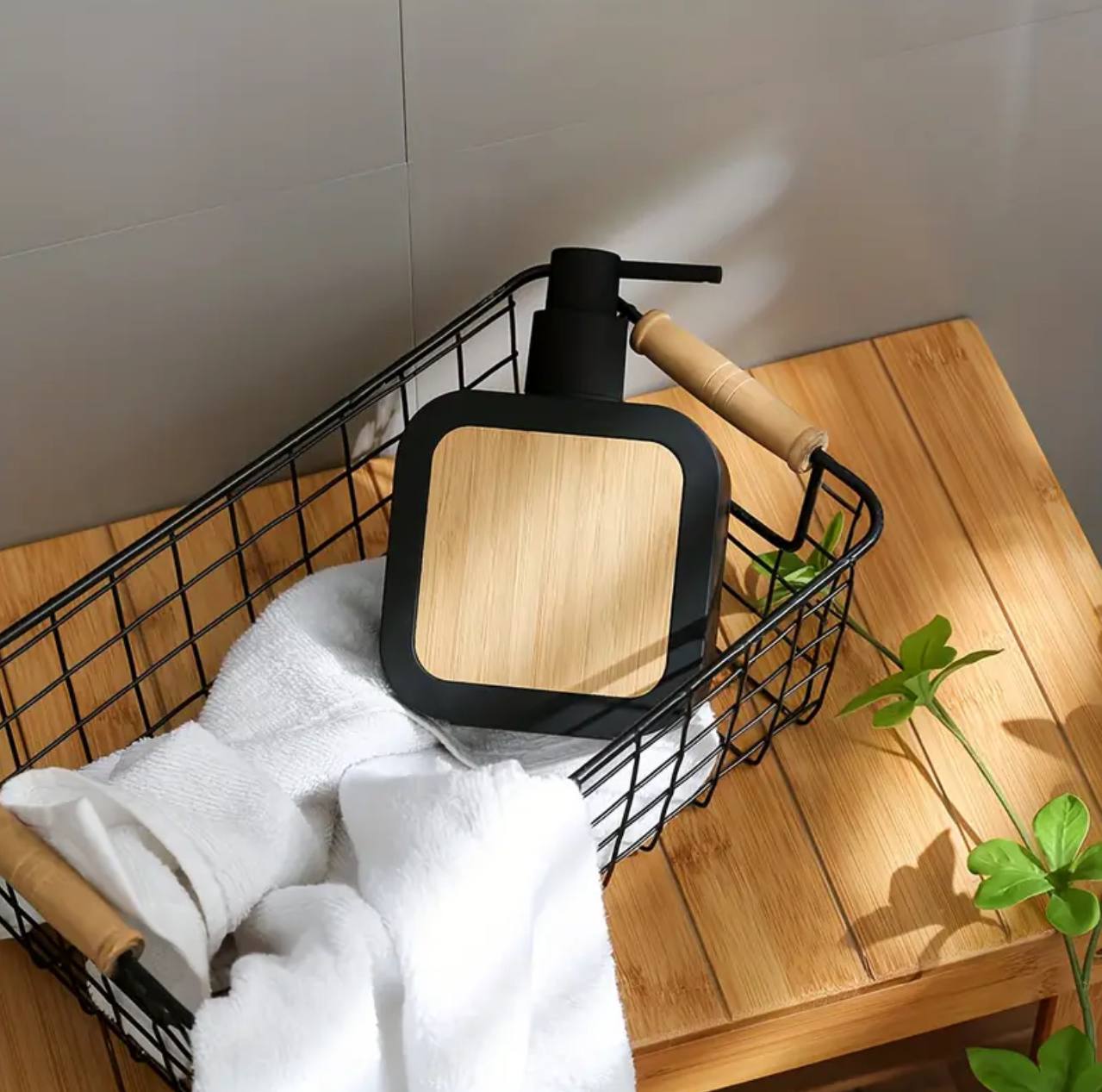 Square plastic soap dispenser with bamboo accent pump.