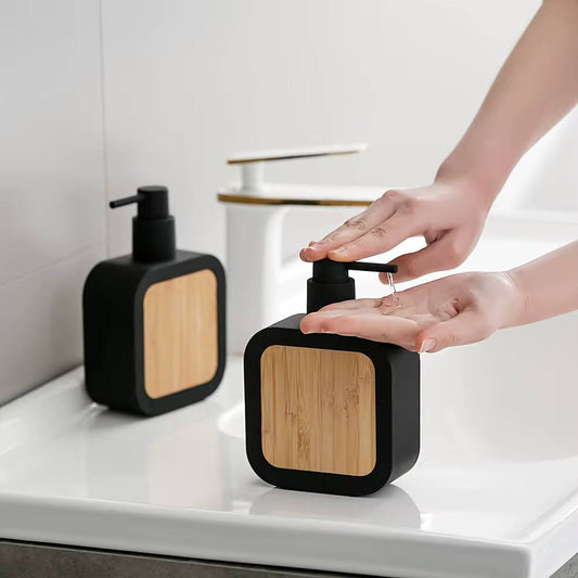 Square plastic soap dispenser with bamboo accent pump