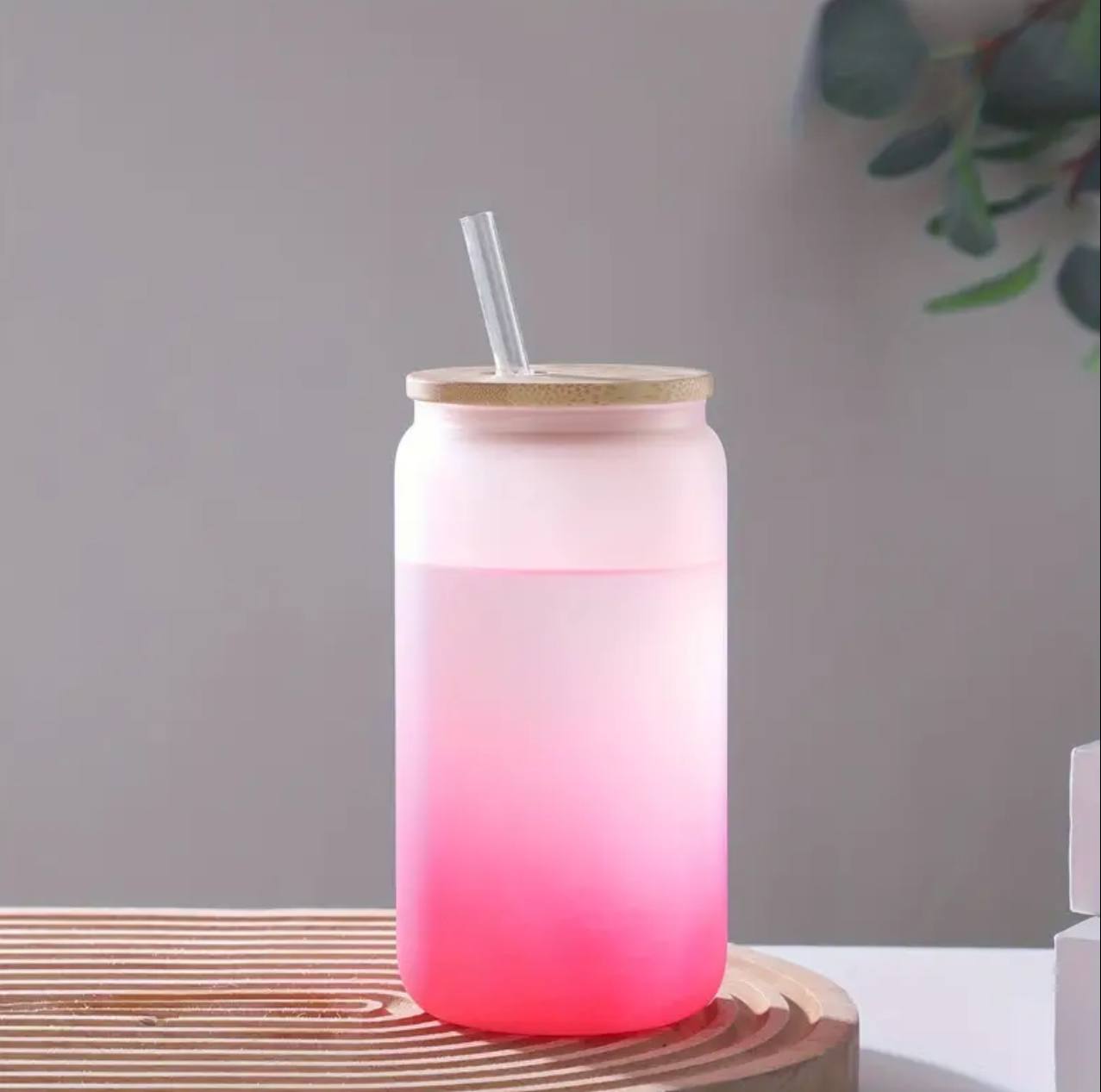 Frosted glass cup with clear glass straw