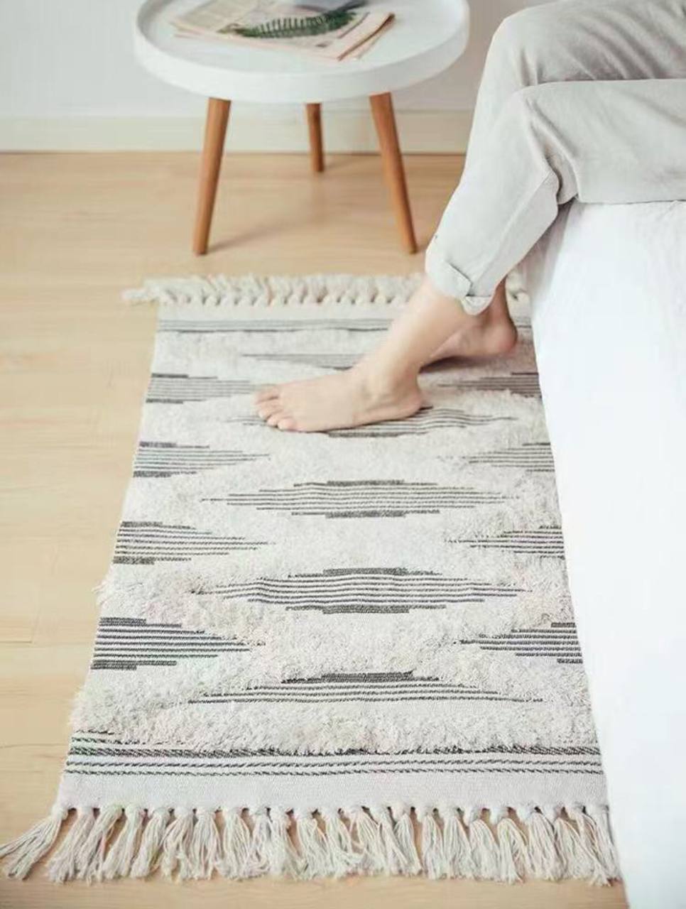 Bohemian Nordic style bedroom rug with tassels