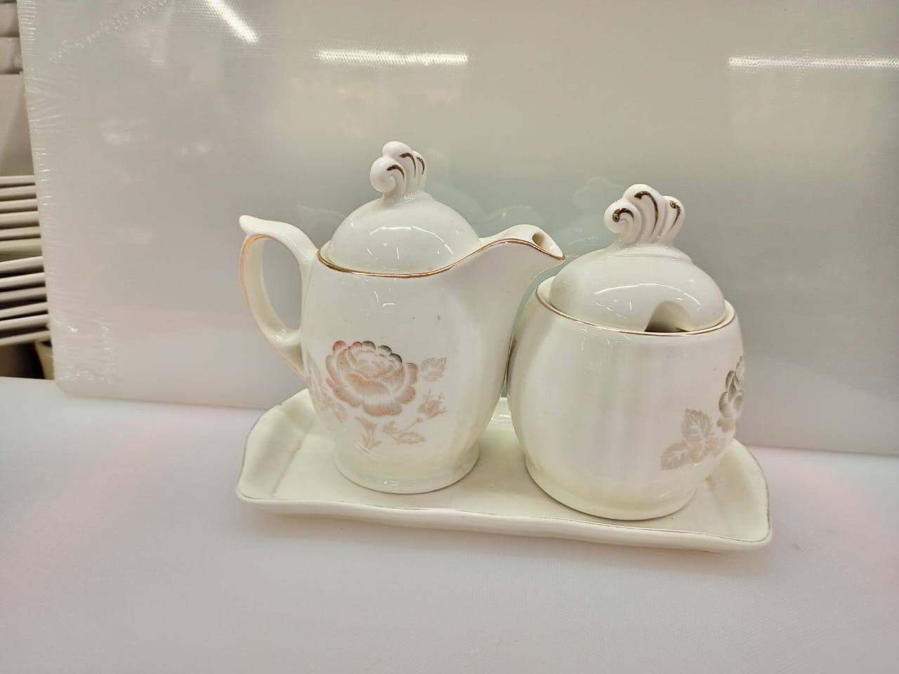 Sugar dish plus milk pot