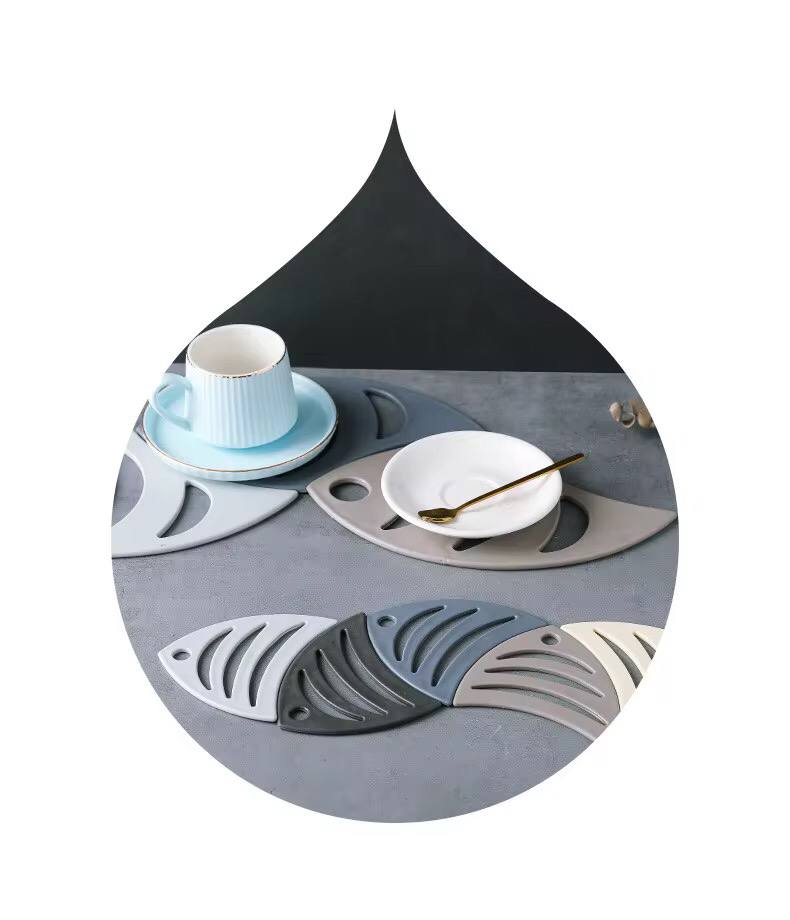 5 pieces fish shaped silicone coasters .