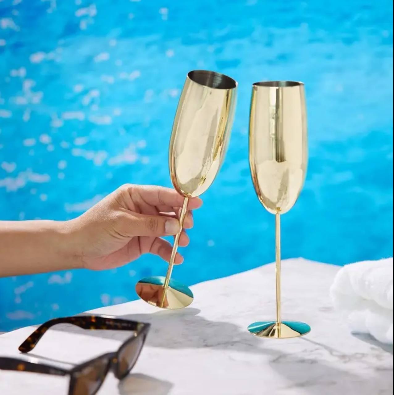 A pair of Gold Stainless steel wine glass