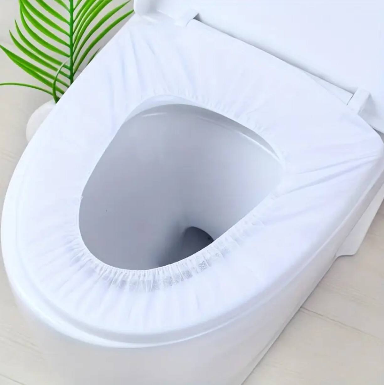 Disposable toilet seat cover .