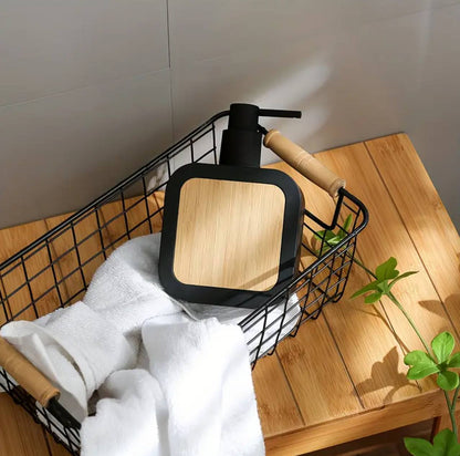Square plastic soap dispenser with bamboo accent pump.