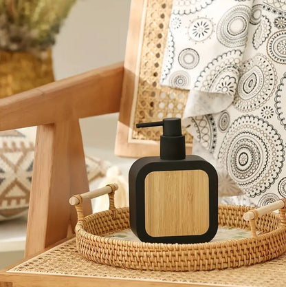 Square plastic soap dispenser with bamboo accent pump.