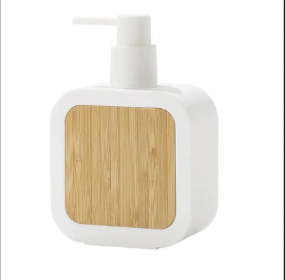 Square plastic soap dispenser with bamboo accent pump.