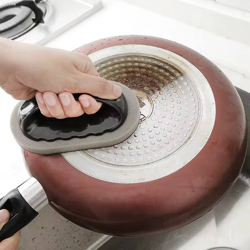 Scrubbing Kitchen Sponge .