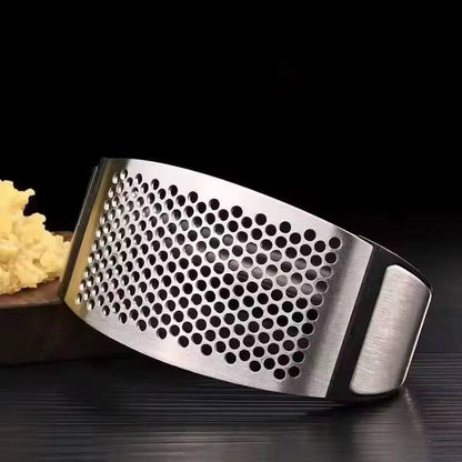 Stainless steel garlic press crusher.