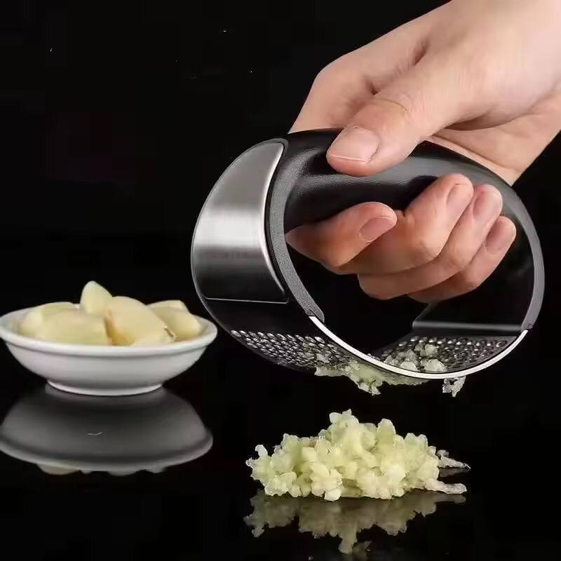 Stainless steel garlic press crusher.