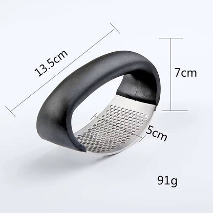 Stainless steel garlic press crusher.