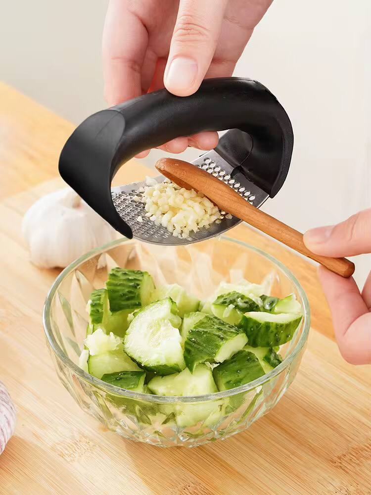 Stainless steel garlic press crusher.
