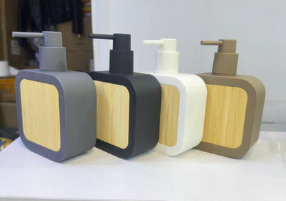 Square plastic soap dispenser with bamboo accent pump