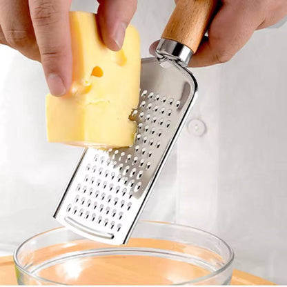 Stainless steel multipurpose grater 
With wooden handle