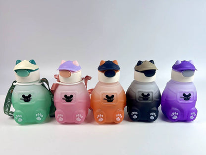 Adorable bear-shaped bottle with a stylish hat or headphone design, sturdy build, and matching strap.