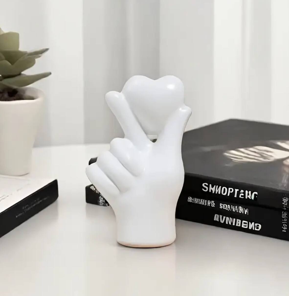 Heart hand gesture decor statue
