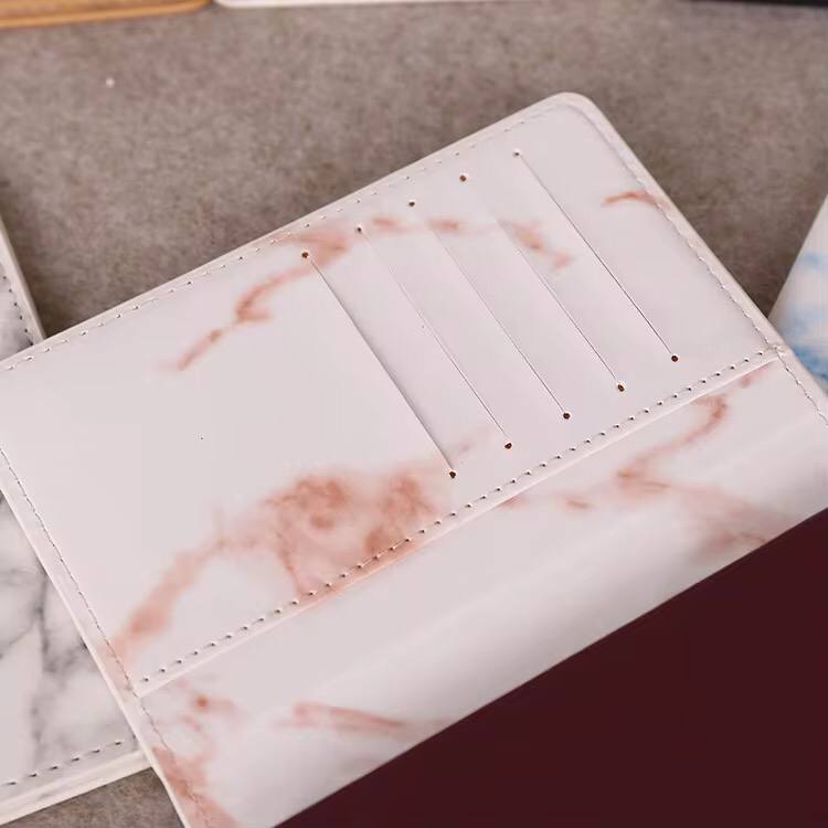 Pu leather passport cover with marble effect.