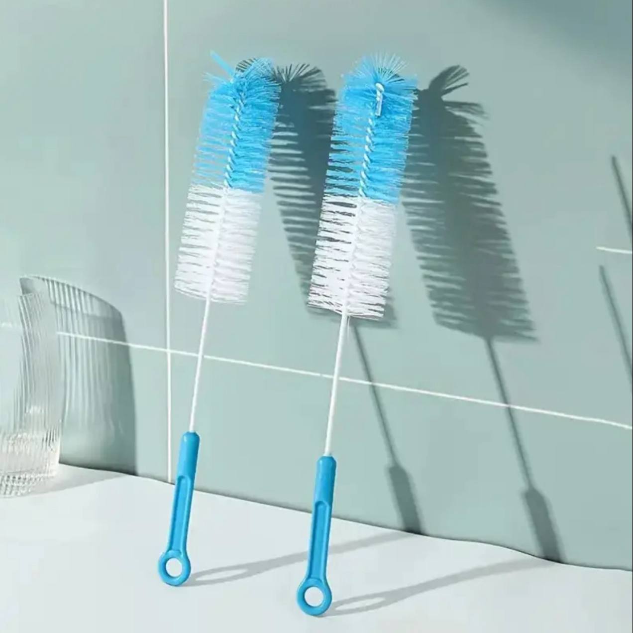 Long handled cleaning brush bottle with an end sponge