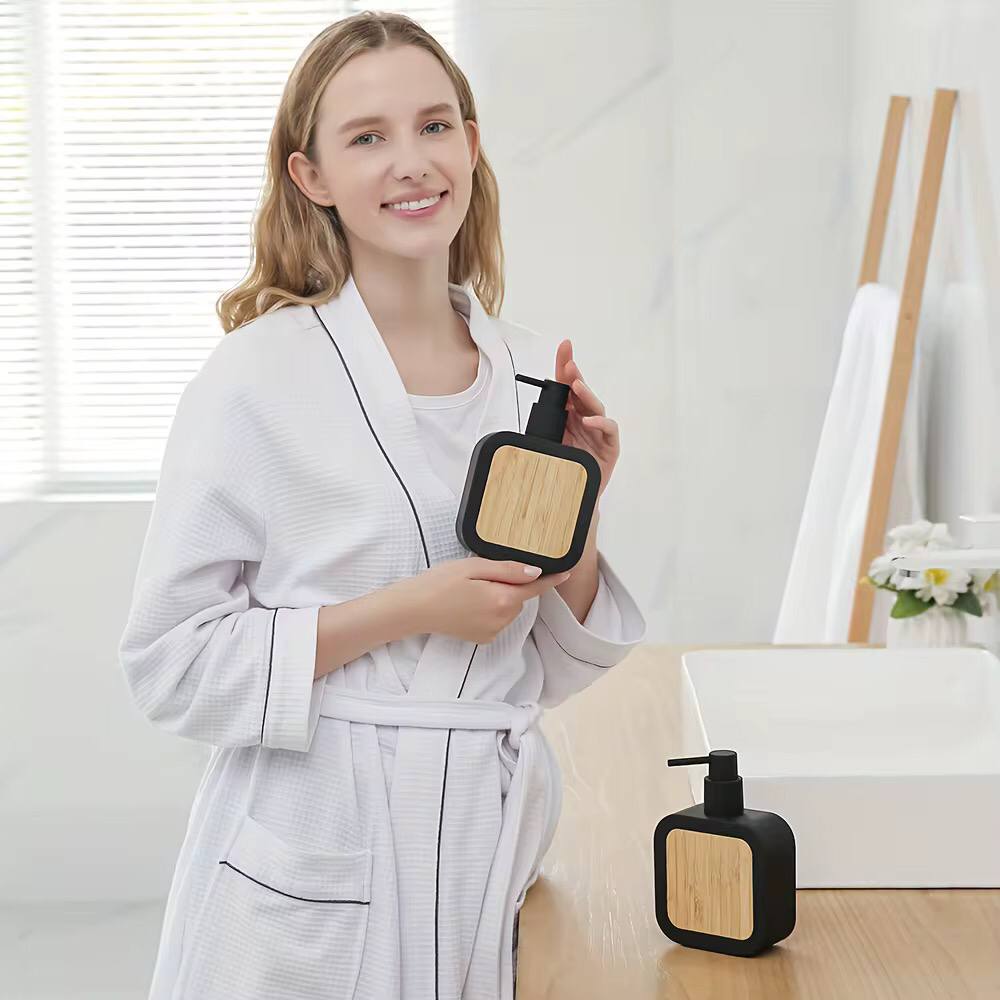Square plastic soap dispenser with bamboo accent pump