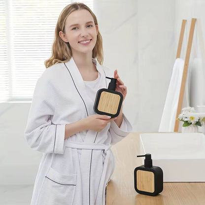 Square plastic soap dispenser with bamboo accent pump
